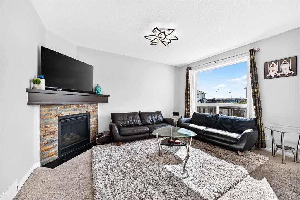 8 Skyview Point Terrace Ne, Calgary, AB - Indoor Photo Showing Living Room With Fireplace