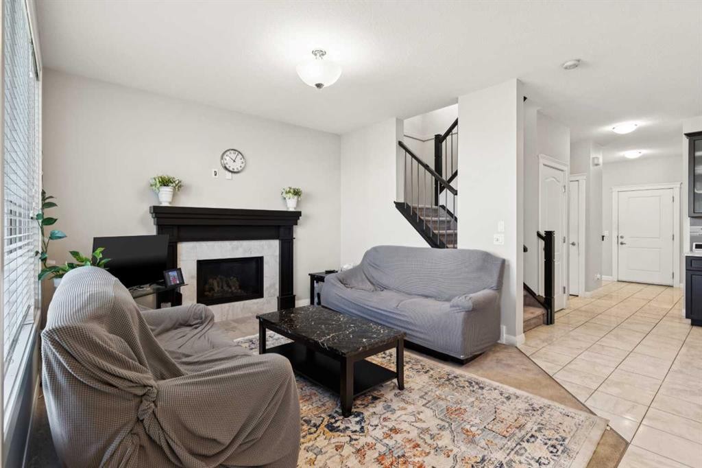 215 Redstone Heights Ne, Calgary, AB - Indoor Photo Showing Living Room With Fireplace