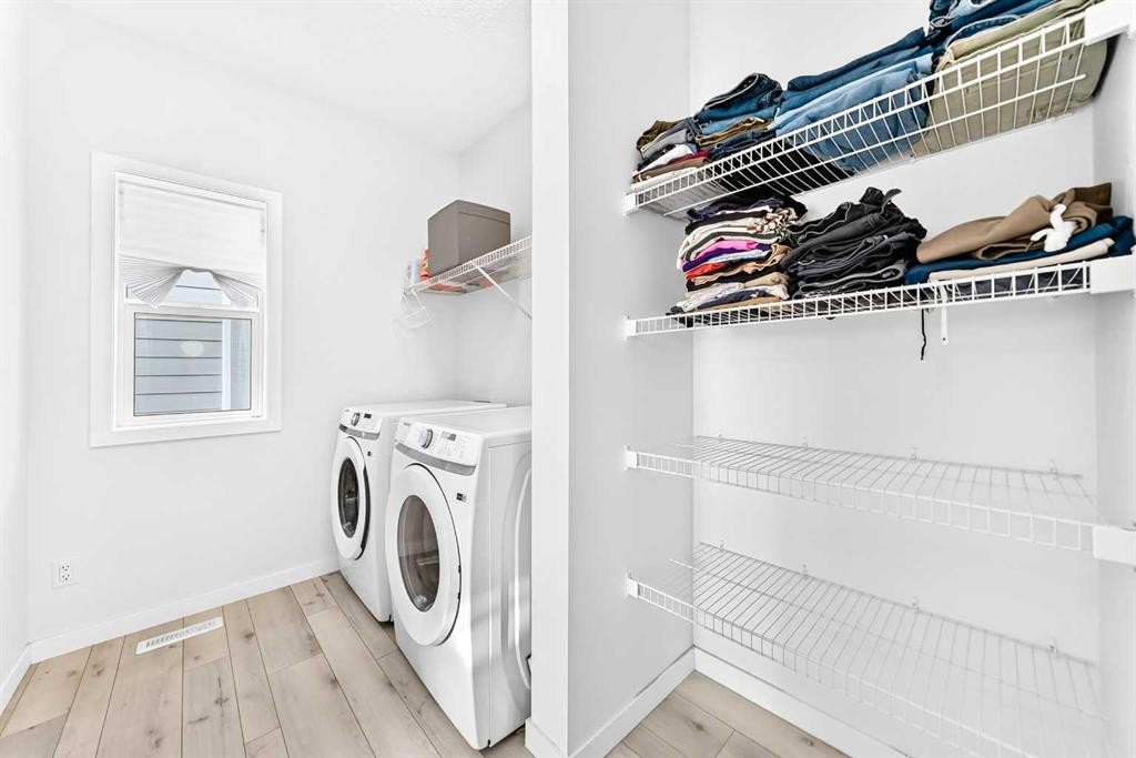 105 Magnolia Manor Se, Calgary, AB - Indoor Photo Showing Laundry Room