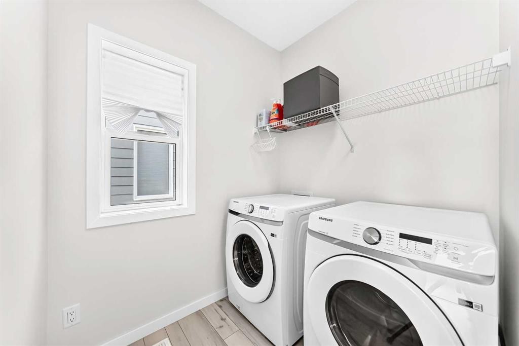 105 Magnolia Manor Se, Calgary, AB - Indoor Photo Showing Laundry Room