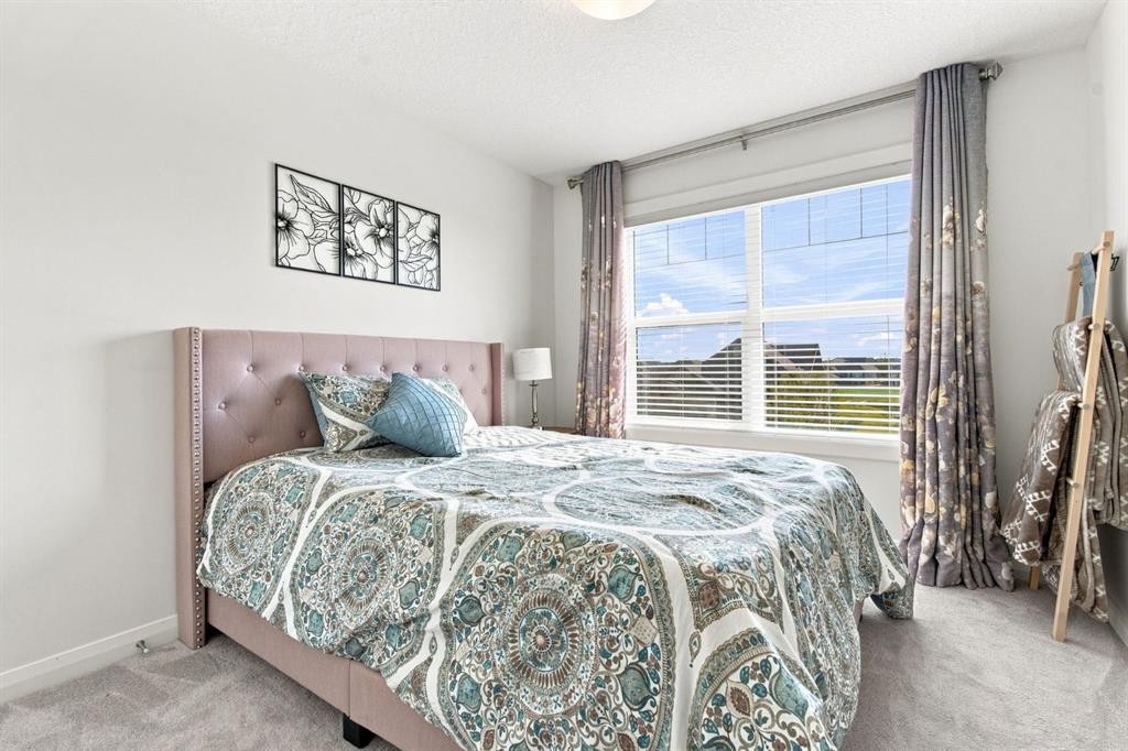 218 Boulder Creek Place, Langdon, AB - Indoor Photo Showing Bedroom