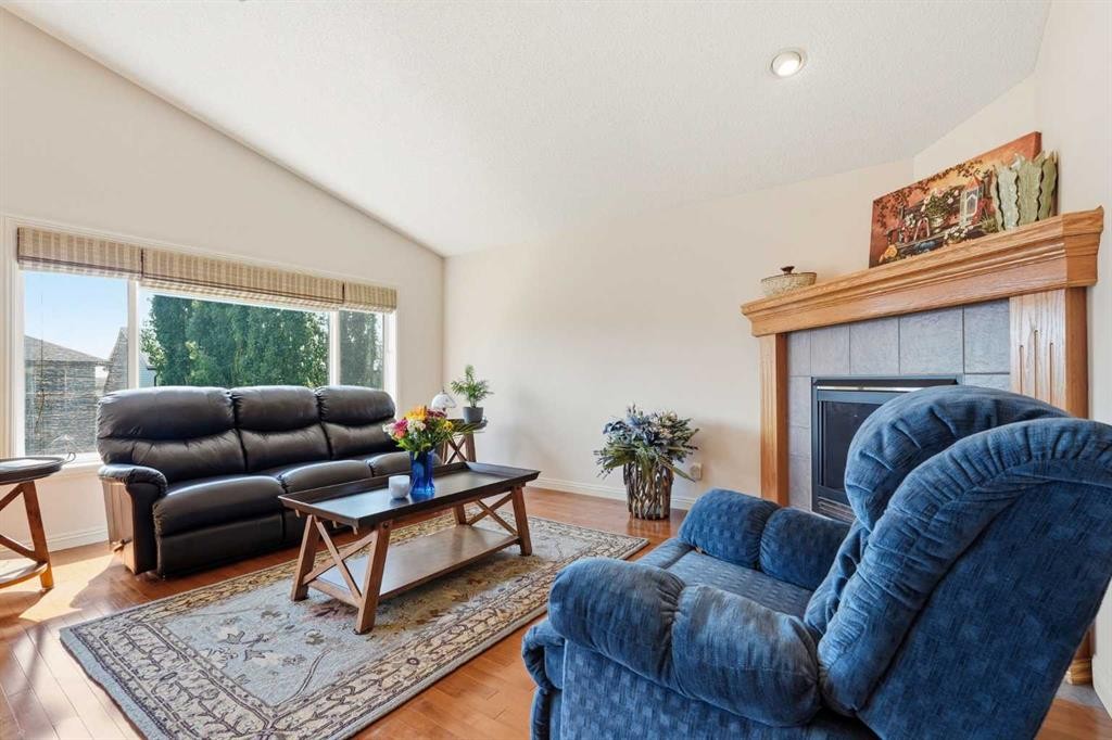 128 Covehaven Gardens Ne, Calgary, AB - Indoor Photo Showing Living Room With Fireplace