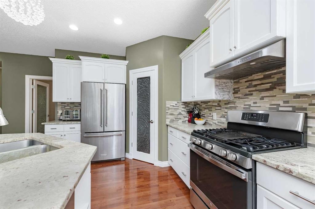 135 Kincora Drive Nw, Calgary, AB - Indoor Photo Showing Kitchen With Stainless Steel Kitchen With Double Sink With Upgraded Kitchen