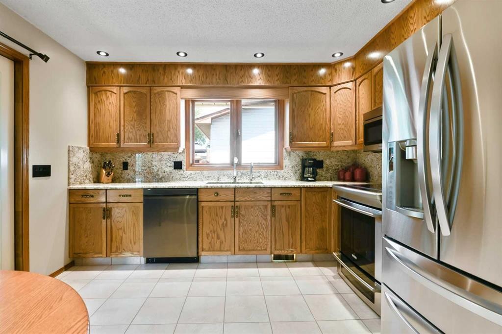 308 Canniff Place Sw, Calgary, AB - Indoor Photo Showing Kitchen With Stainless Steel Kitchen