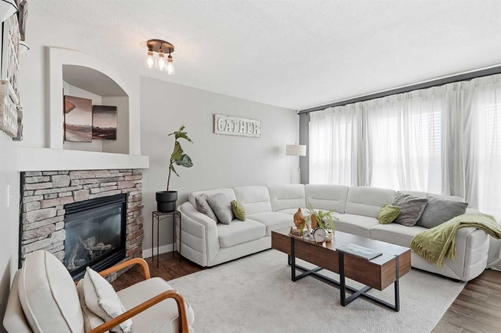 138 Somerglen Common Sw, Calgary, AB - Indoor Photo Showing Living Room With Fireplace
