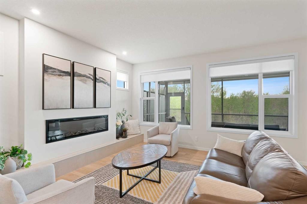 500 Cranbrook Gardens Se, Calgary, AB - Indoor Photo Showing Living Room With Fireplace