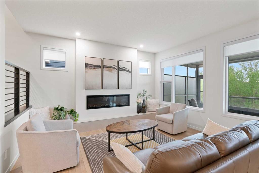 500 Cranbrook Gardens Se, Calgary, AB - Indoor Photo Showing Living Room With Fireplace