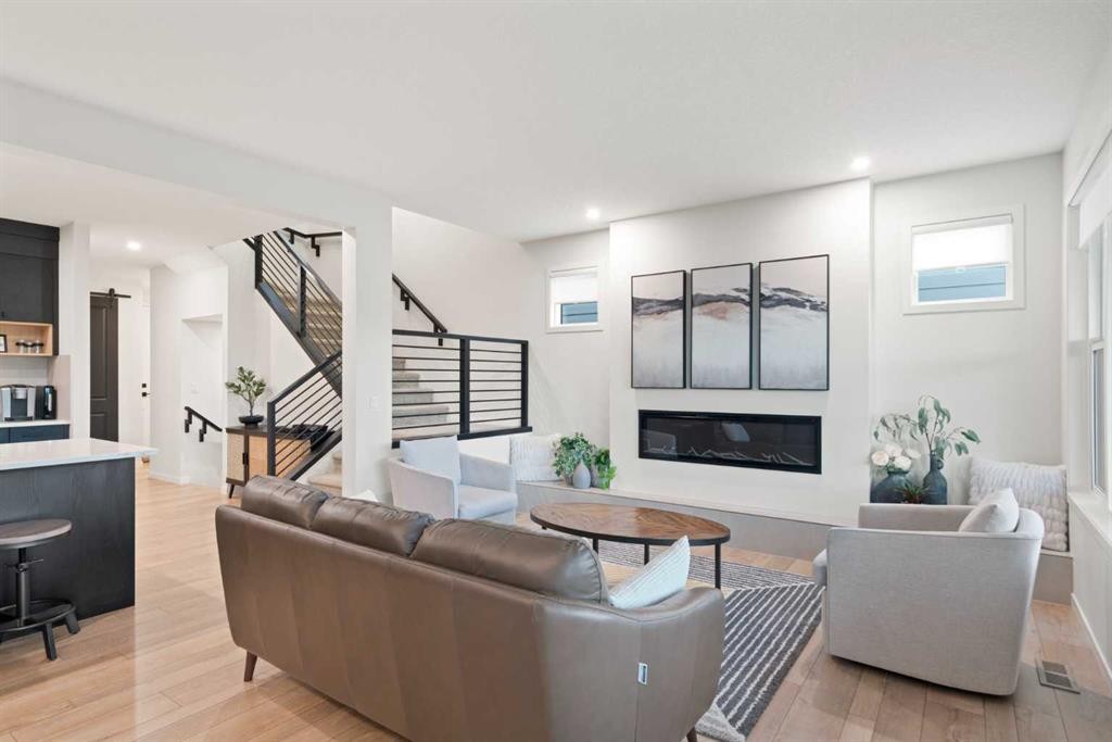 500 Cranbrook Gardens Se, Calgary, AB - Indoor Photo Showing Living Room With Fireplace