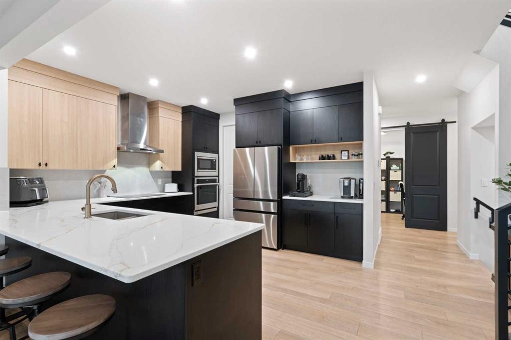 500 Cranbrook Gardens Se, Calgary, AB - Indoor Photo Showing Kitchen With Stainless Steel Kitchen With Upgraded Kitchen