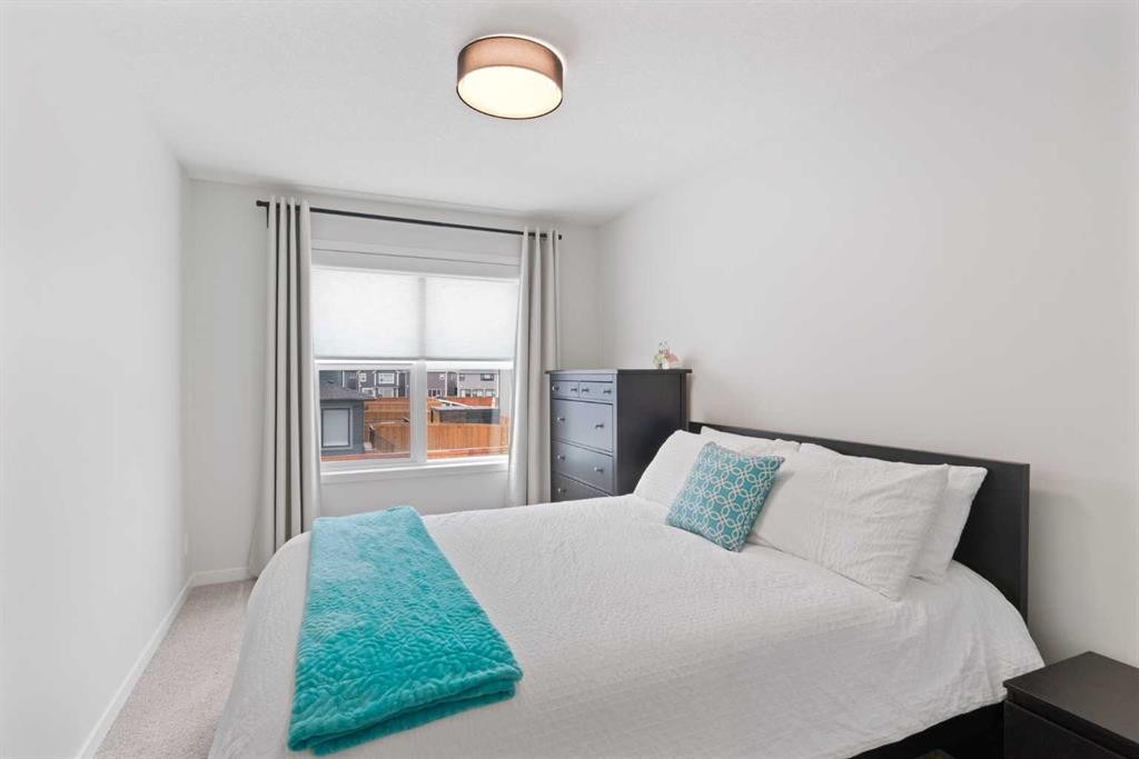 500 Cranbrook Gardens Se, Calgary, AB - Indoor Photo Showing Bedroom