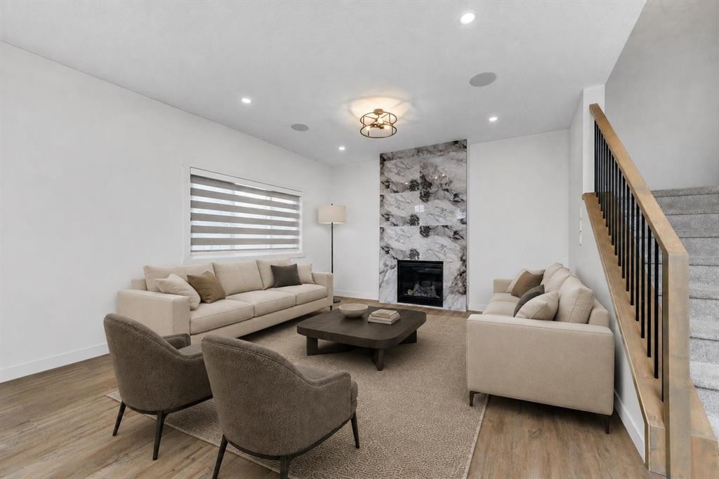 124 Heritage Boulevard, Cochrane, AB - Indoor Photo Showing Living Room With Fireplace