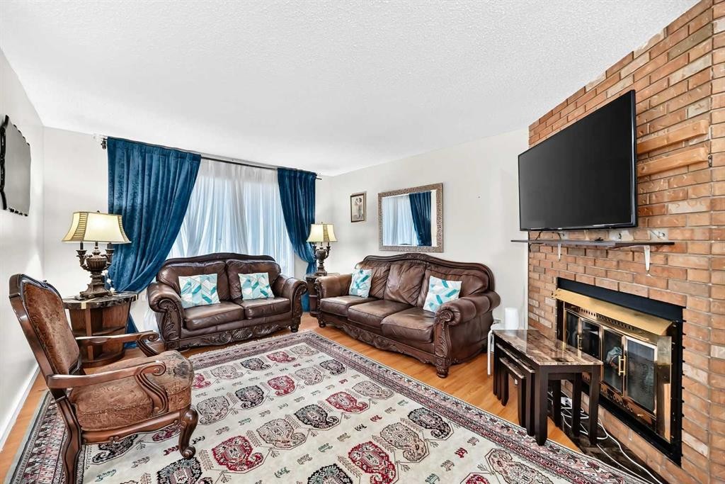 617 Whitewood Road Ne, Calgary, AB - Indoor Photo Showing Living Room With Fireplace