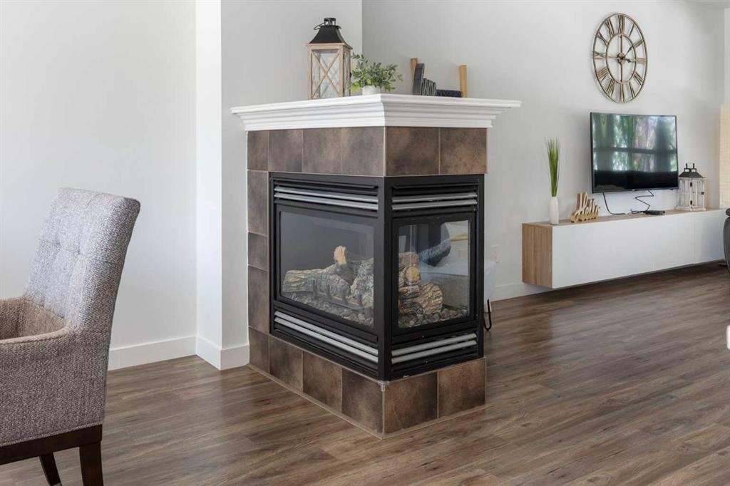 17 Auburn Bay View Se, Calgary, AB - Indoor Photo Showing Other Room With Fireplace