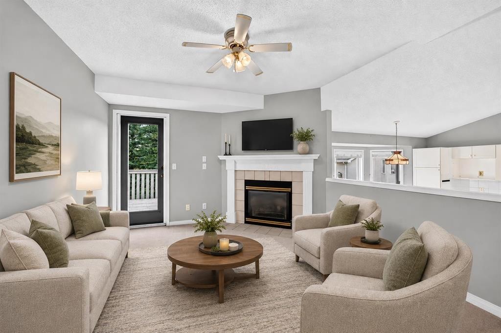 23 Sunlake Gardens Se, Calgary, AB - Indoor Photo Showing Living Room With Fireplace