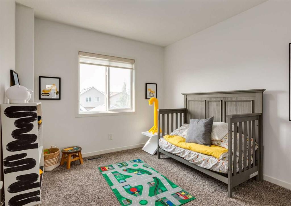 71 Seton Gardens Se, Calgary, AB - Indoor Photo Showing Bedroom