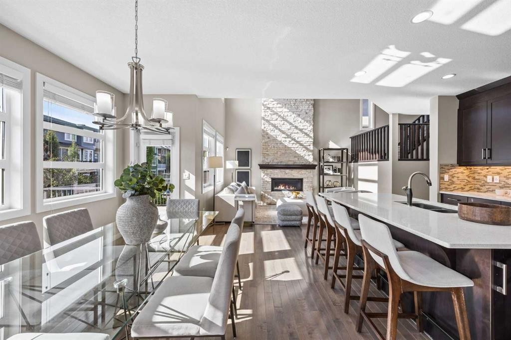 29 Aspen Summit Point Sw, Calgary, AB - Indoor Photo Showing Dining Room With Fireplace