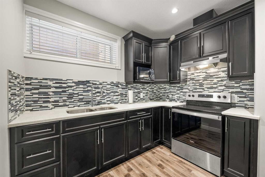 183 Aspen Acres Manor Sw, Calgary, AB - Indoor Photo Showing Kitchen With Double Sink