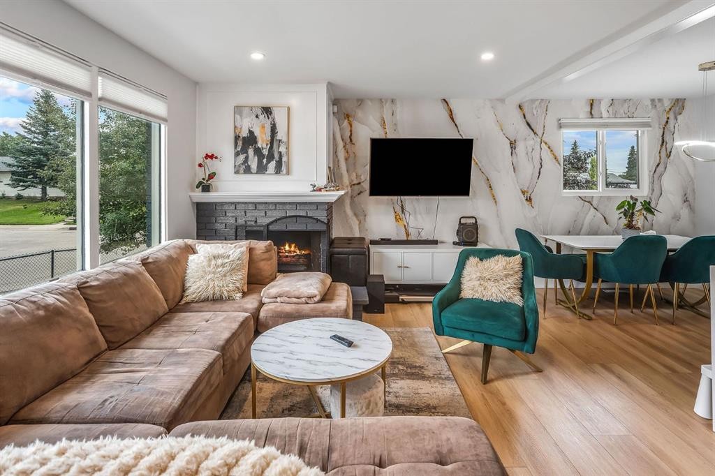 703 Millar Road Ne, Calgary, AB - Indoor Photo Showing Living Room With Fireplace