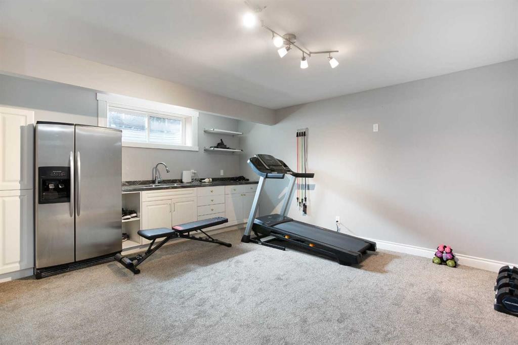 1153 Kingston Crescent Se, Airdrie, AB - Indoor Photo Showing Gym Room