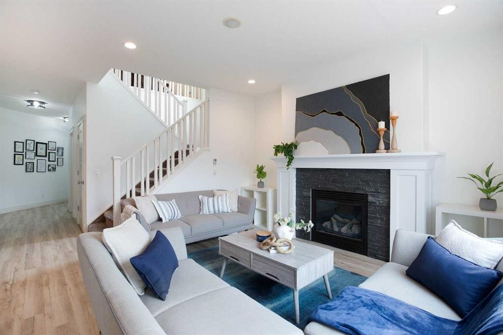 1153 Kingston Crescent Se, Airdrie, AB - Indoor Photo Showing Living Room With Fireplace