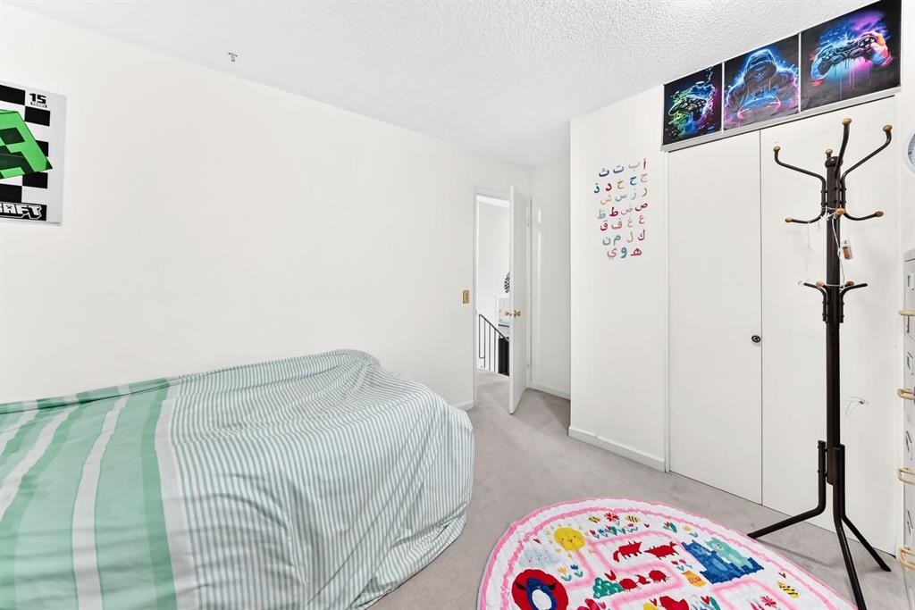983 Rundlecairn Way Ne, Calgary, AB - Indoor Photo Showing Bedroom