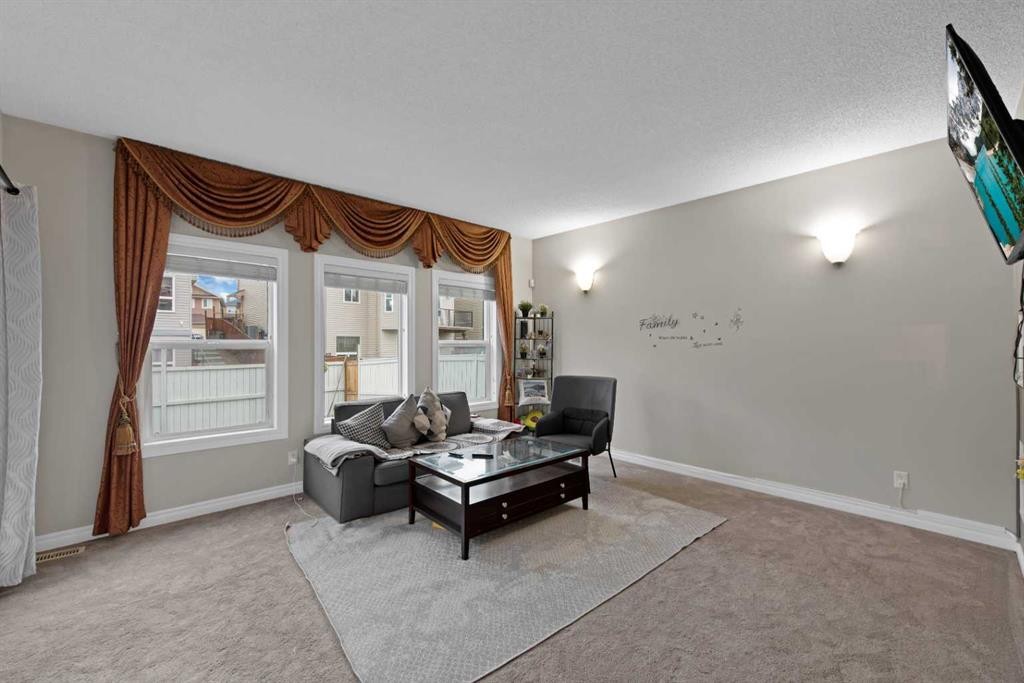 77 Saddleland Drive Ne, Calgary, AB - Indoor Photo Showing Living Room