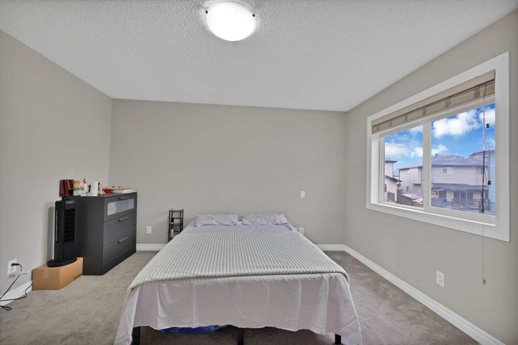 77 Saddleland Drive Ne, Calgary, AB - Indoor Photo Showing Bedroom