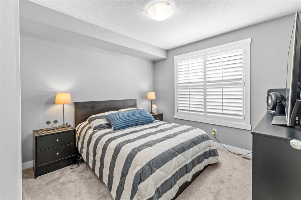 145 Cranford Walk Se, Calgary, AB - Indoor Photo Showing Bedroom