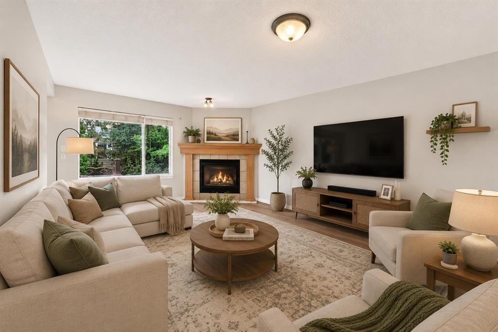 352 Copperfield Gardens Se, Calgary, AB - Indoor Photo Showing Living Room With Fireplace