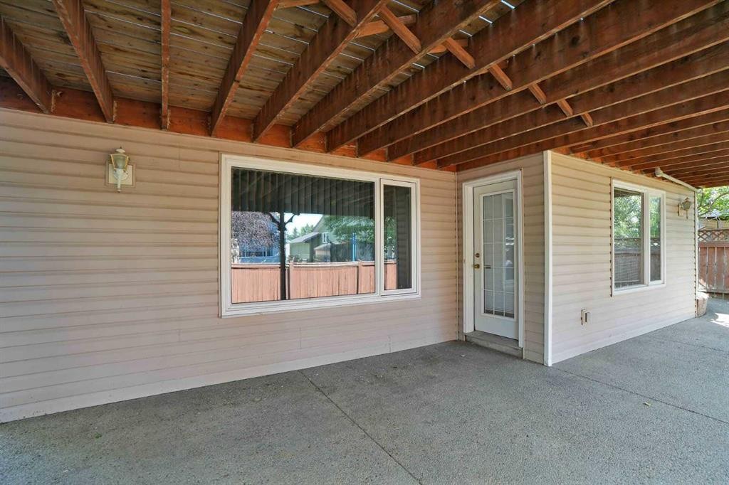 62 West Mitford Crescent, Cochrane, AB - Outdoor With Deck Patio Veranda With Exterior