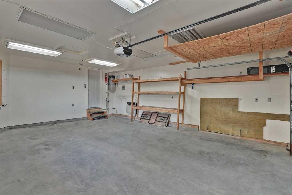 62 West Mitford Crescent, Cochrane, AB - Indoor Photo Showing Garage