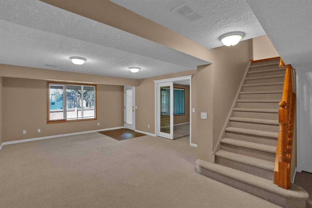 62 West Mitford Crescent, Cochrane, AB - Indoor Photo Showing Other Room