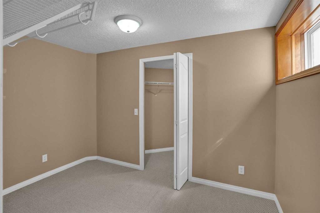 62 West Mitford Crescent, Cochrane, AB - Indoor Photo Showing Other Room