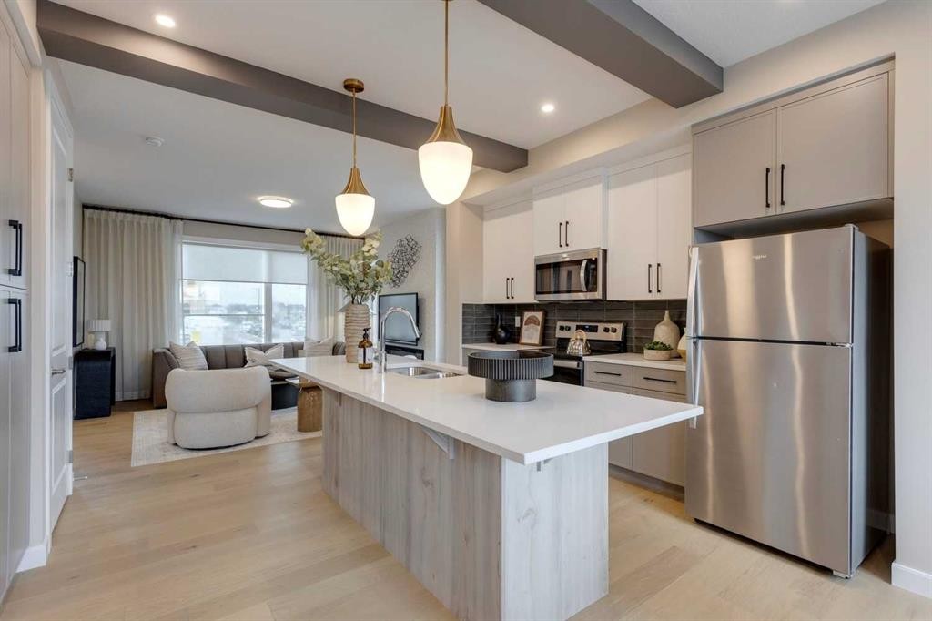 189 Cobblestone Gate Sw, Airdrie, AB - Indoor Photo Showing Kitchen With Stainless Steel Kitchen