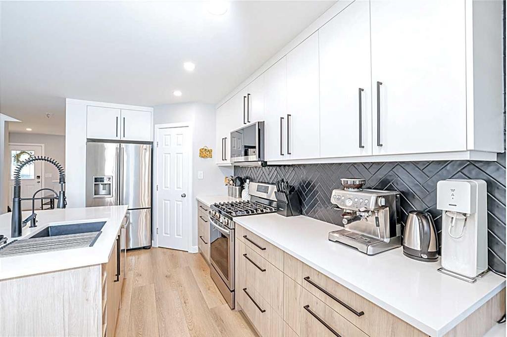 28 Copperfield Heath Se, Calgary, AB - Indoor Photo Showing Kitchen With Stainless Steel Kitchen With Upgraded Kitchen