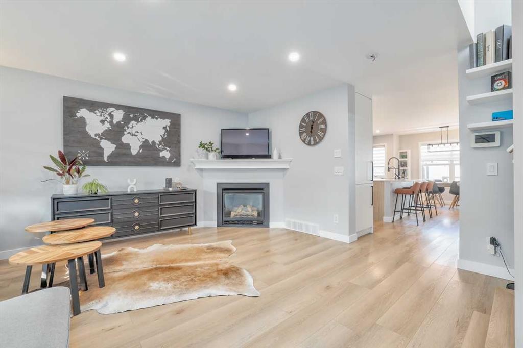 28 Copperfield Heath Se, Calgary, AB - Indoor Photo Showing Living Room With Fireplace