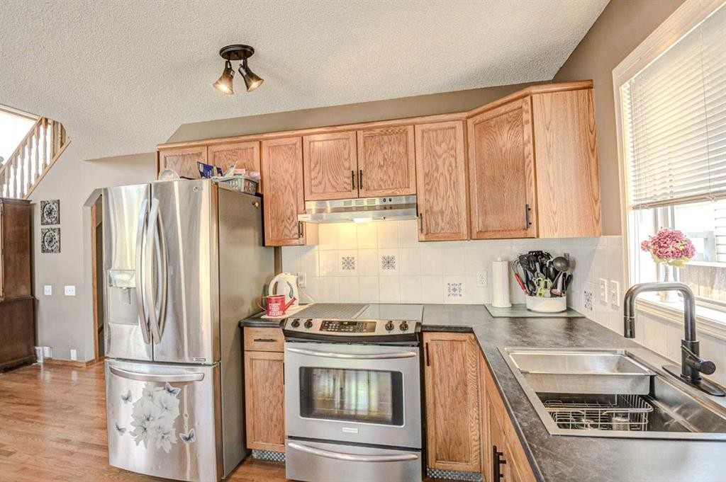 124 Del Ray Close Ne, Calgary, AB - Indoor Photo Showing Kitchen With Stainless Steel Kitchen With Double Sink