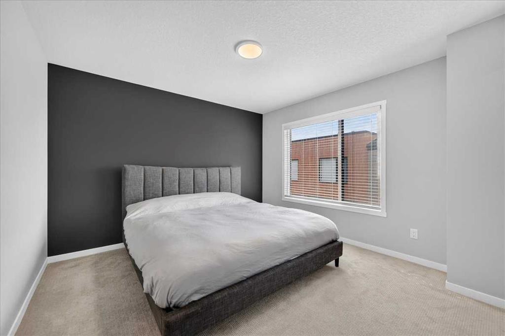 401-81 Midtown Boulevard Sw, Airdrie, AB - Indoor Photo Showing Bedroom