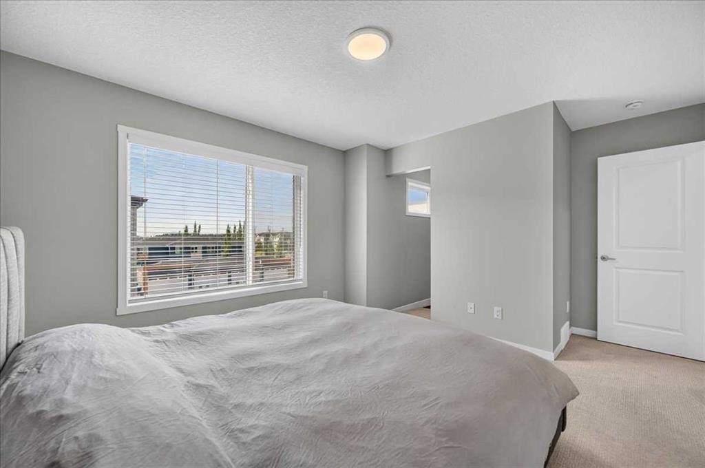 401-81 Midtown Boulevard Sw, Airdrie, AB - Indoor Photo Showing Bedroom