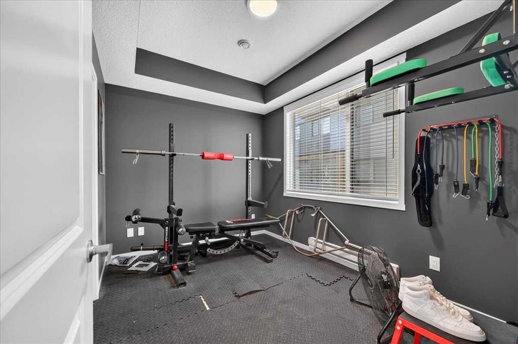 401-81 Midtown Boulevard Sw, Airdrie, AB - Indoor Photo Showing Gym Room