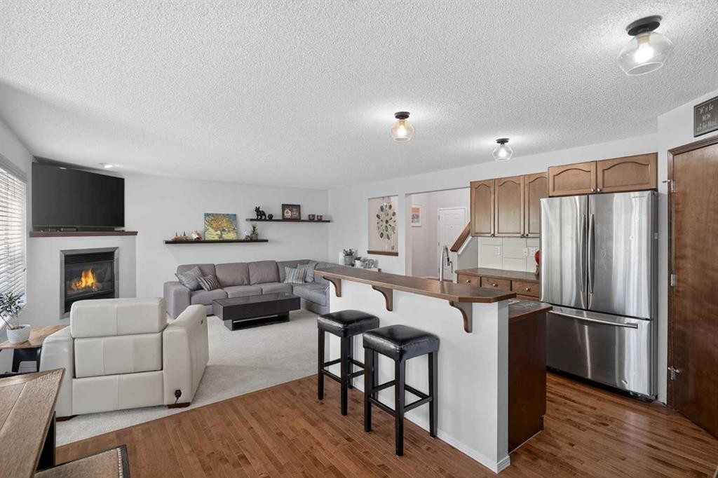 288 Evansbrooke Way Nw, Calgary, AB - Indoor Photo Showing Other Room With Fireplace