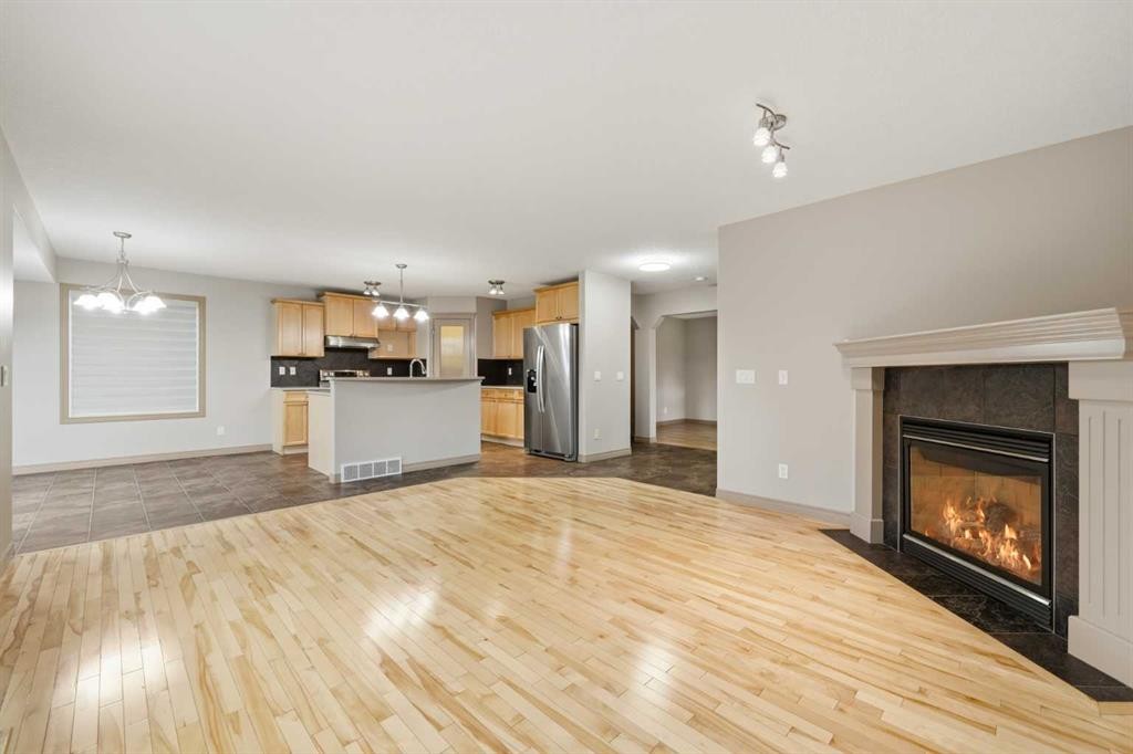 137 Evanscove Circle Nw, Calgary, AB - Indoor Photo Showing Living Room With Fireplace