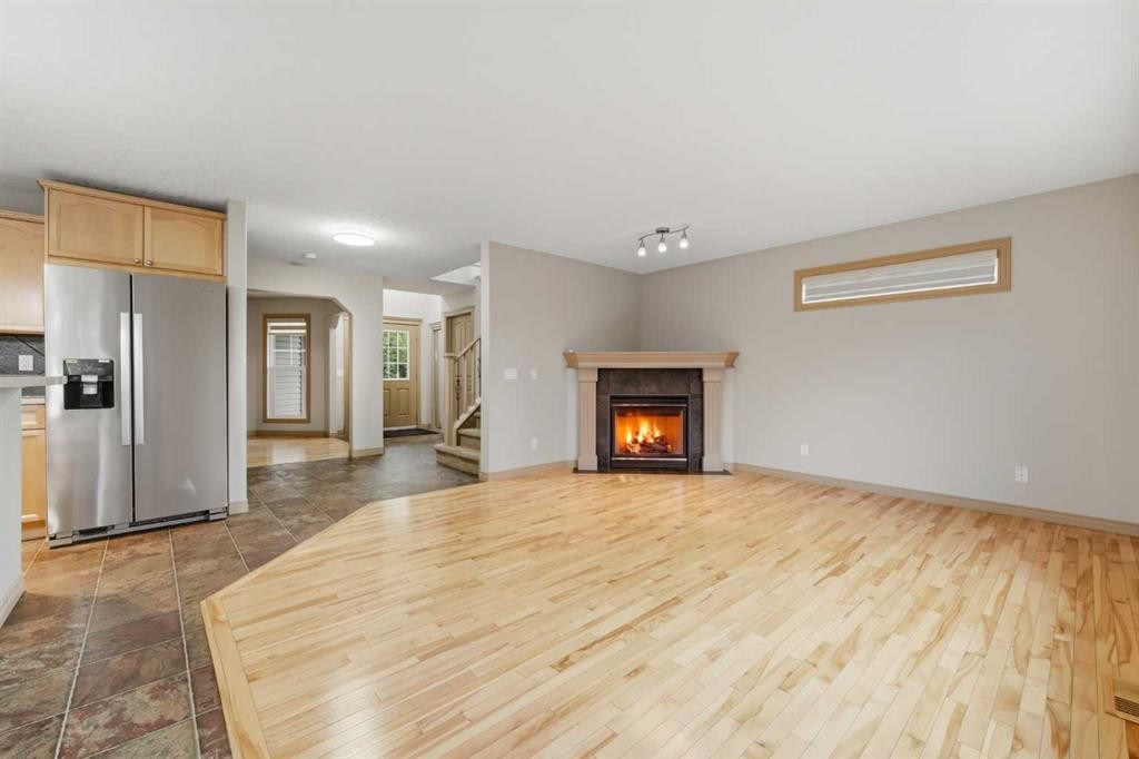 137 Evanscove Circle Nw, Calgary, AB - Indoor Photo Showing Living Room With Fireplace