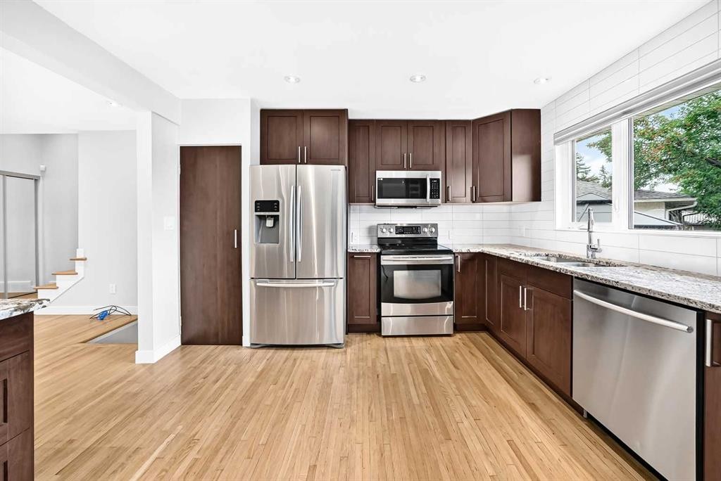 173 Cornwallis Drive Nw, Calgary, AB - Indoor Photo Showing Kitchen With Stainless Steel Kitchen With Double Sink