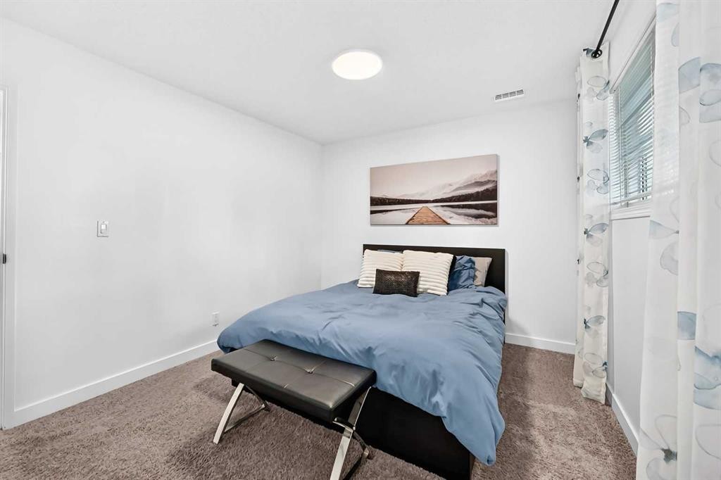 D-109 Stanley Avenue, Okotoks, AB - Indoor Photo Showing Bedroom