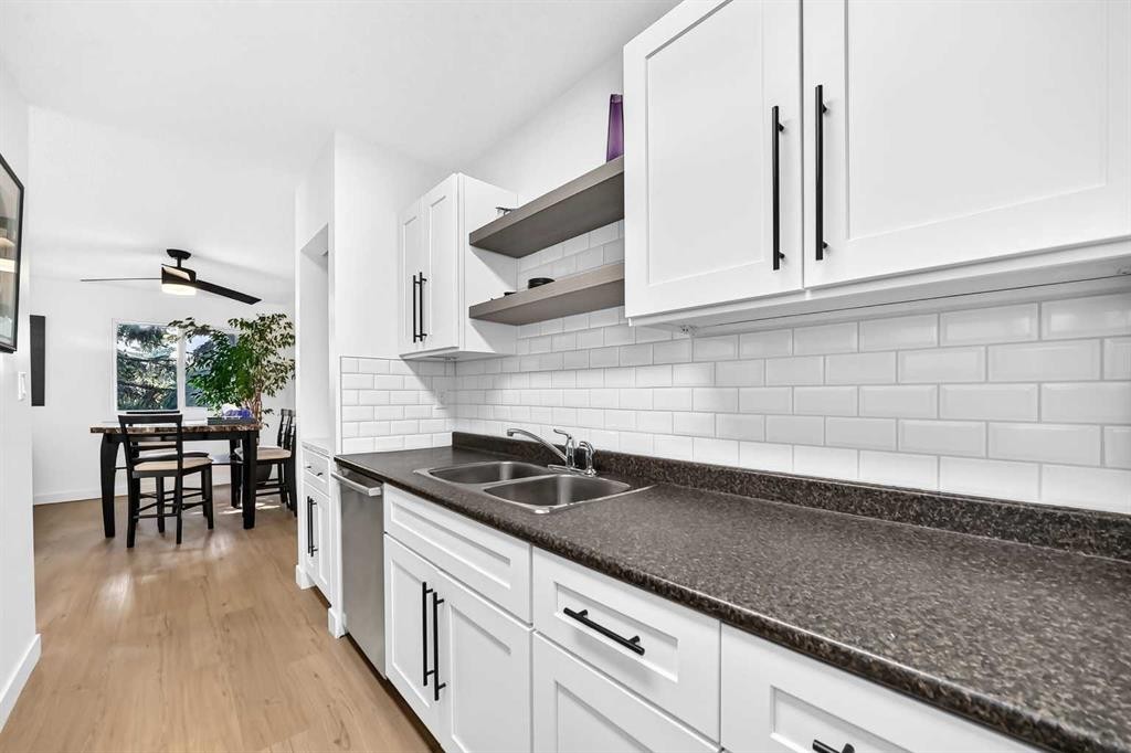 D-109 Stanley Avenue, Okotoks, AB - Indoor Photo Showing Kitchen With Double Sink
