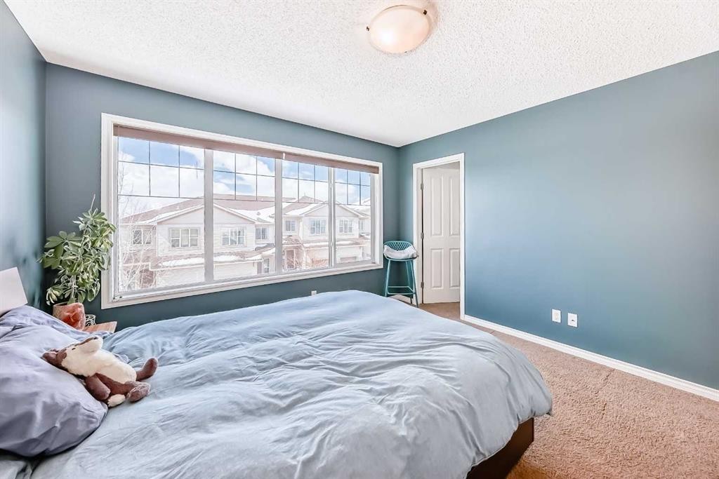 296 Sunset Point, Cochrane, AB - Indoor Photo Showing Bedroom