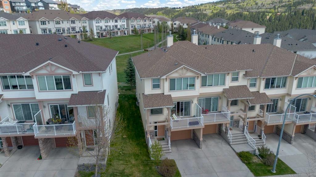 296 Sunset Point, Cochrane, AB - Outdoor With Deck Patio Veranda With Facade