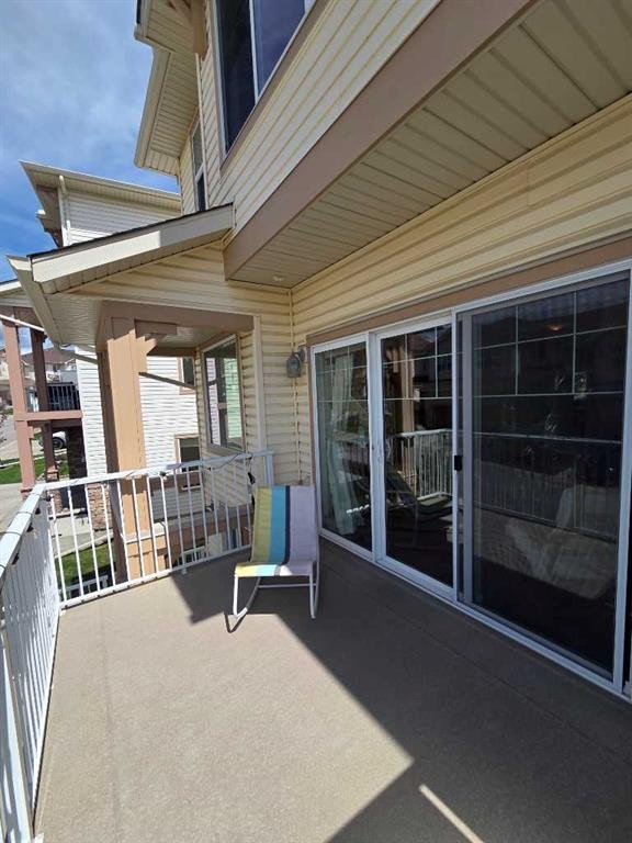 296 Sunset Point, Cochrane, AB - Outdoor With Deck Patio Veranda With Exterior