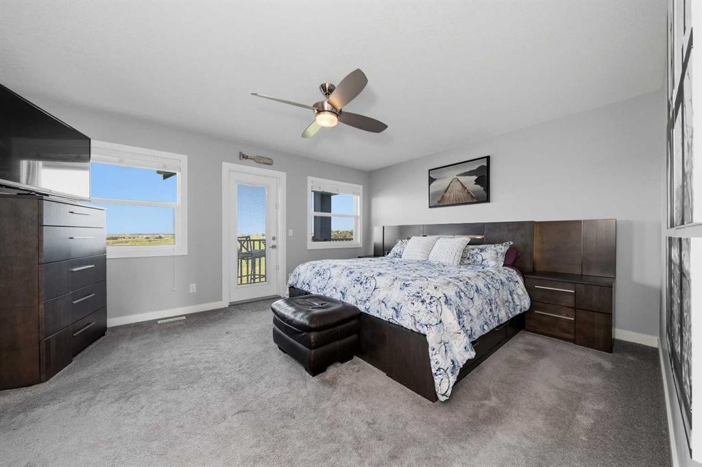 395 Boulder Creek Bay Se, Langdon, AB - Indoor Photo Showing Bedroom